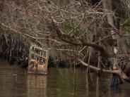 Old Amite River speed limit sign for boaters